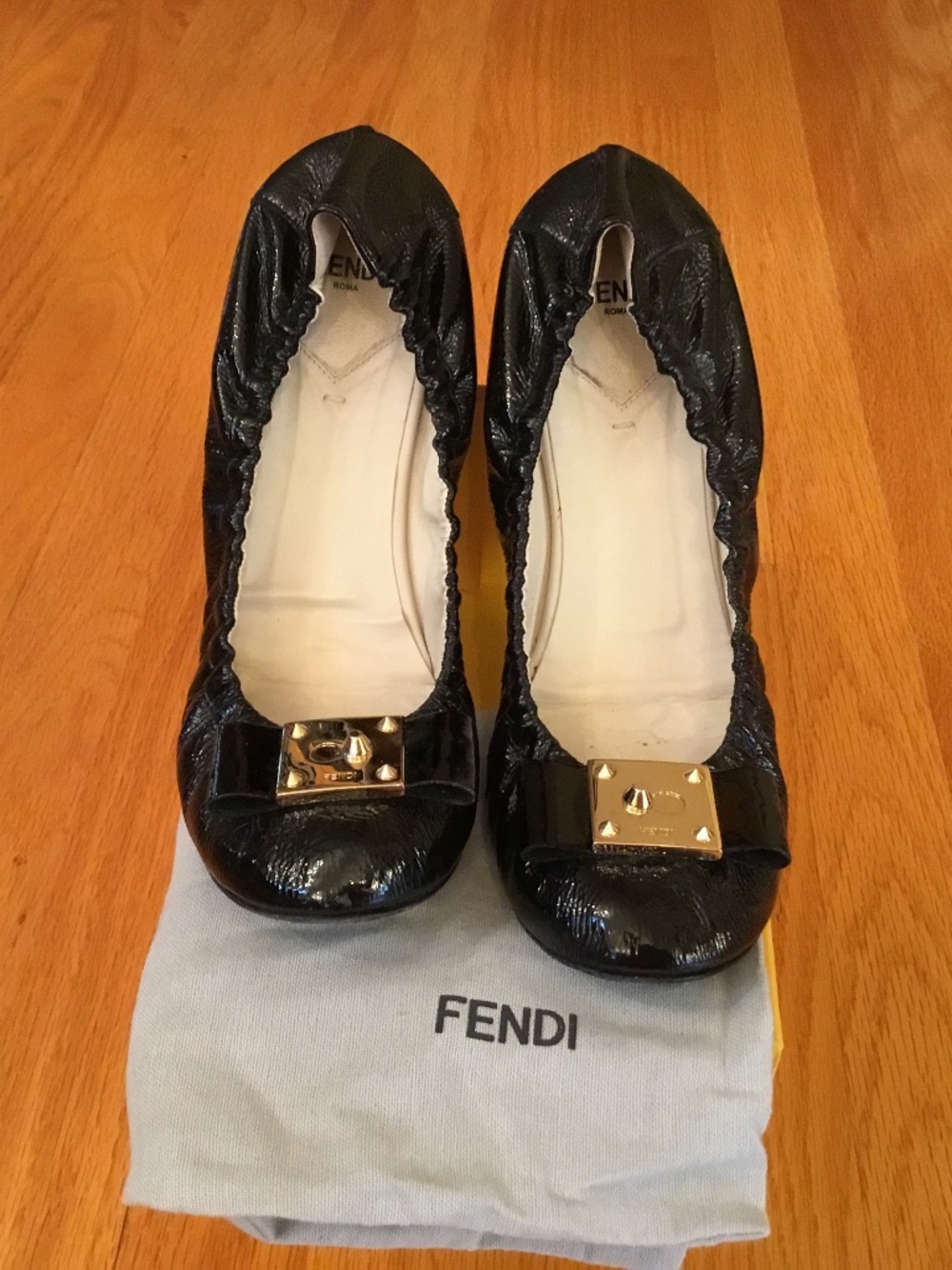 FENDI DESIGNER PATENT LEATHER BALLERINA FLATS WITH SIGNATURE GOLD PLATE